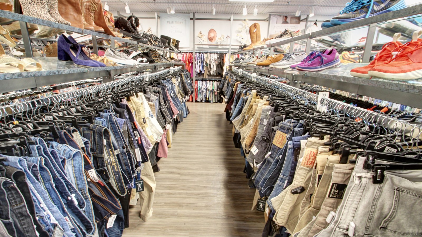 Organized clothing racks inside Uptown Cheapskate Longview