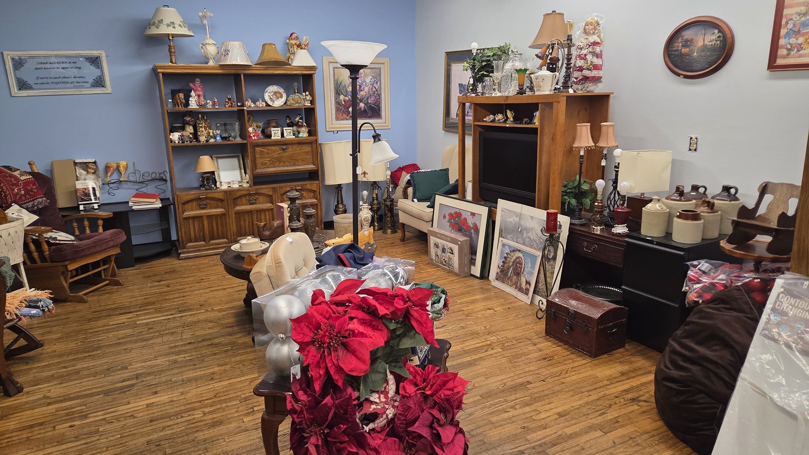 Furniture, lamps, and framed decor inside Reclaimed Riches