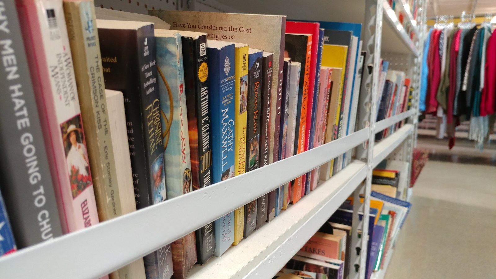 Books and clothing aisles at Goodwill in Alexandria