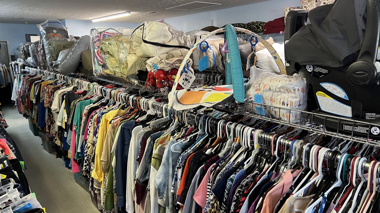Clothing aisles and housewares inside A CUT Above Consignment in Ashland