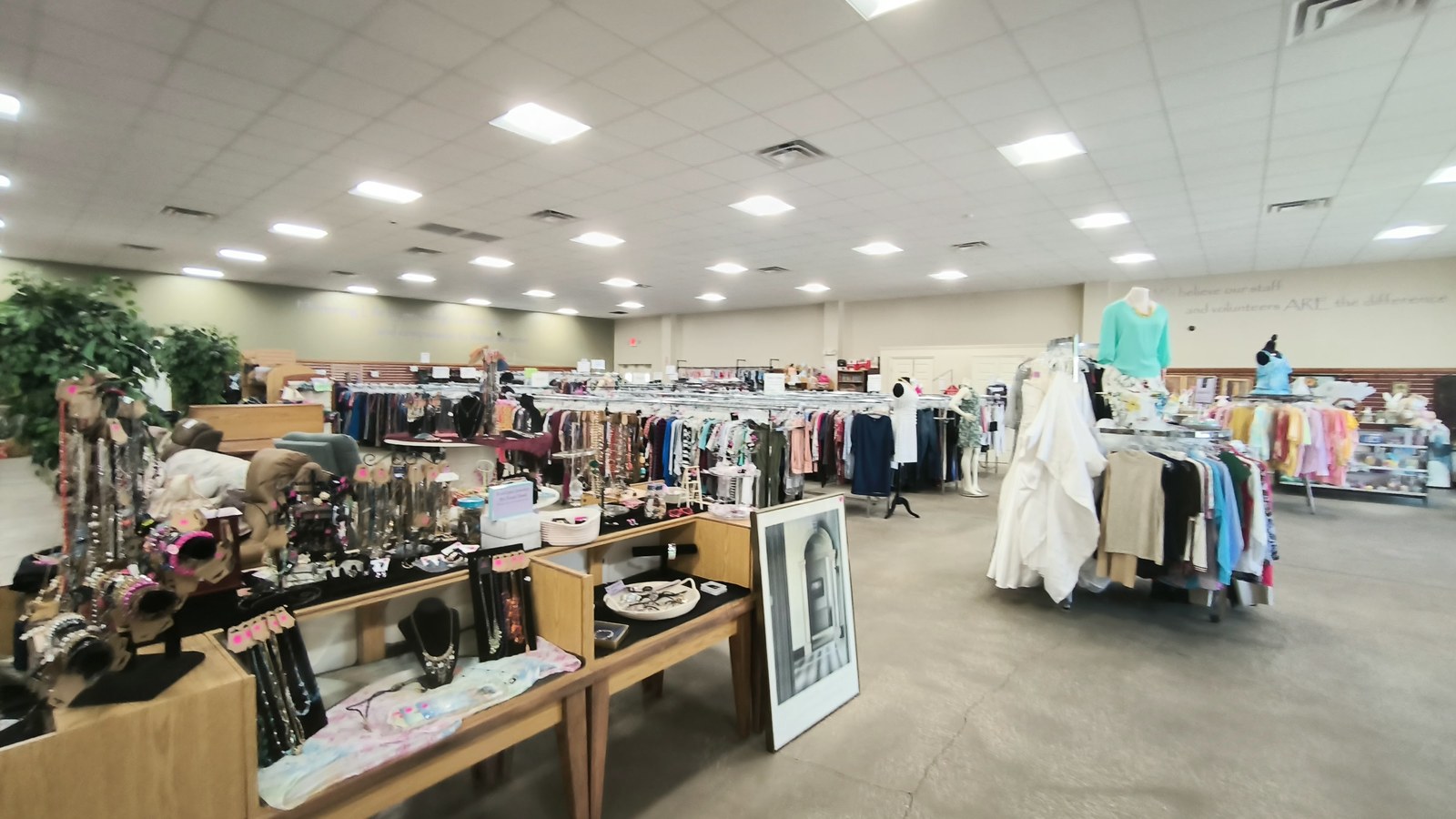 Clothing racks jewelry displays and furniture across Haven Attic Resale Store in Orange Park