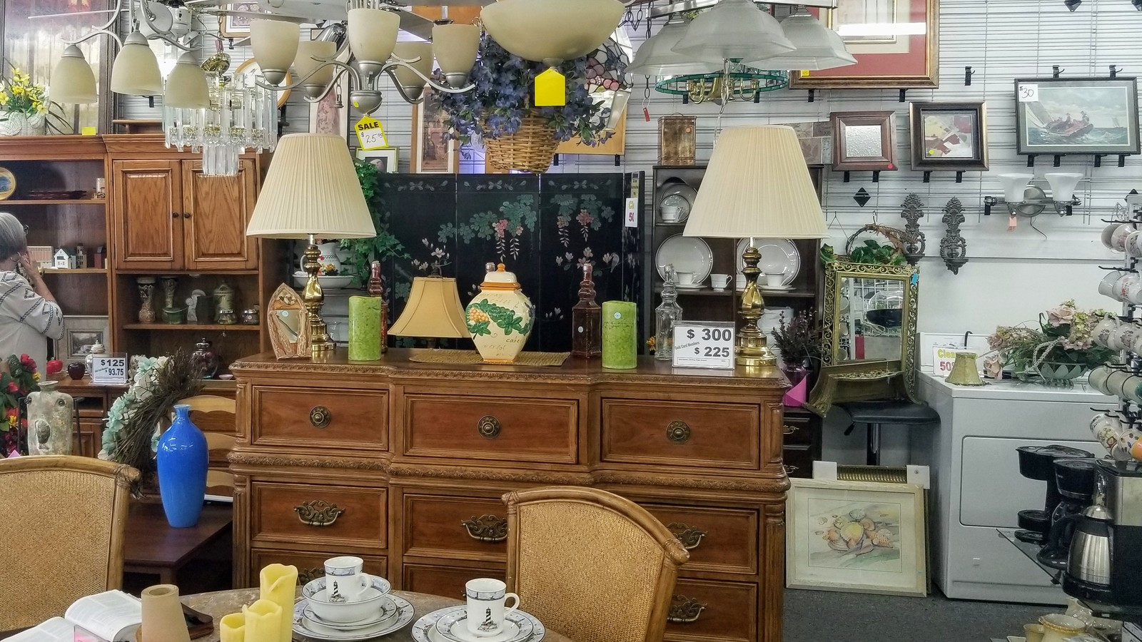 Lamps, framed art, and furniture inside Thrift Boutique of First UMC in Port Orange