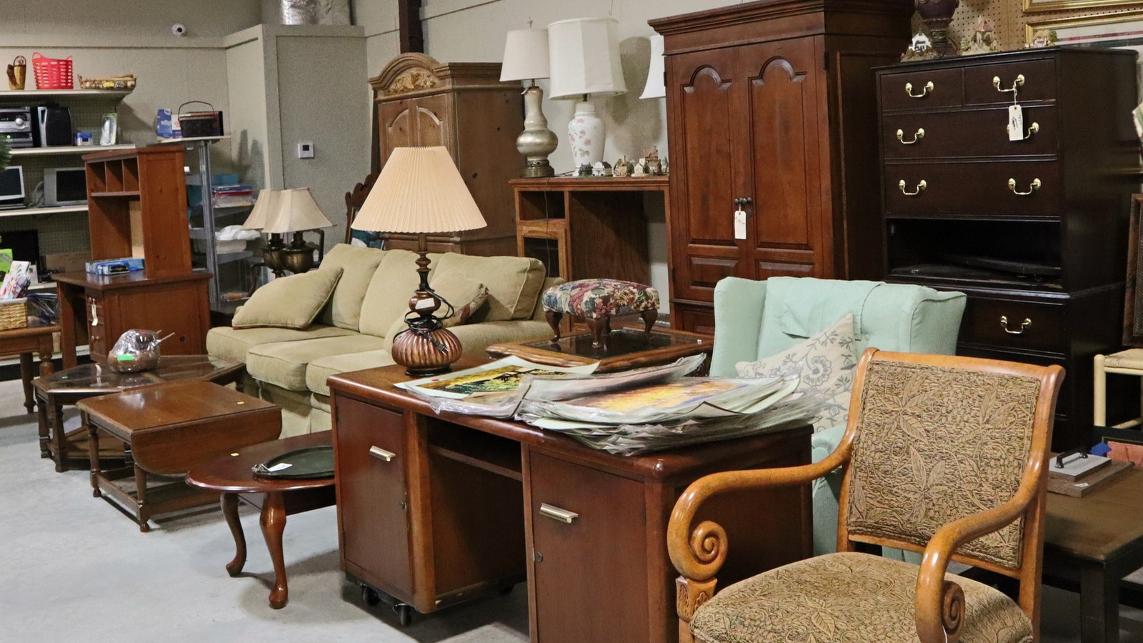 Furniture and home decor displays inside Tail's End Thrift Store in Wetumpka