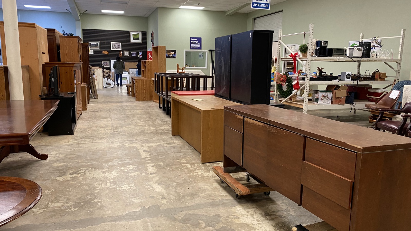 Lighting, cabinets, and home project inventory inside Habitat ReStore in Bentonville