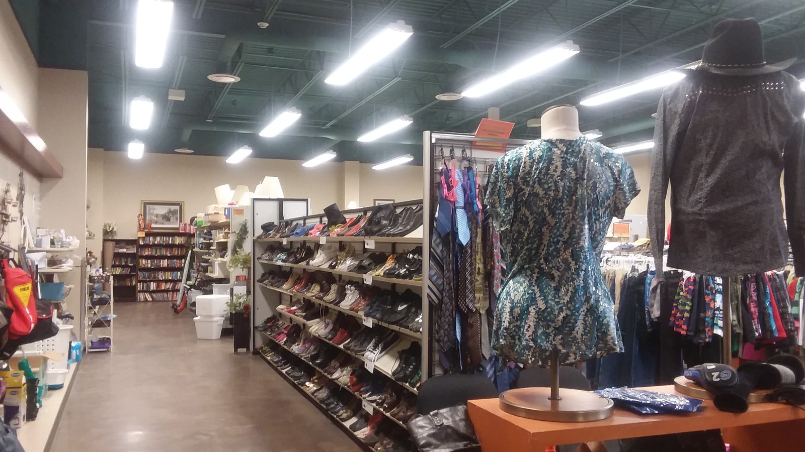 Shoe shelves and clothing displays inside The Arc of Dickinson