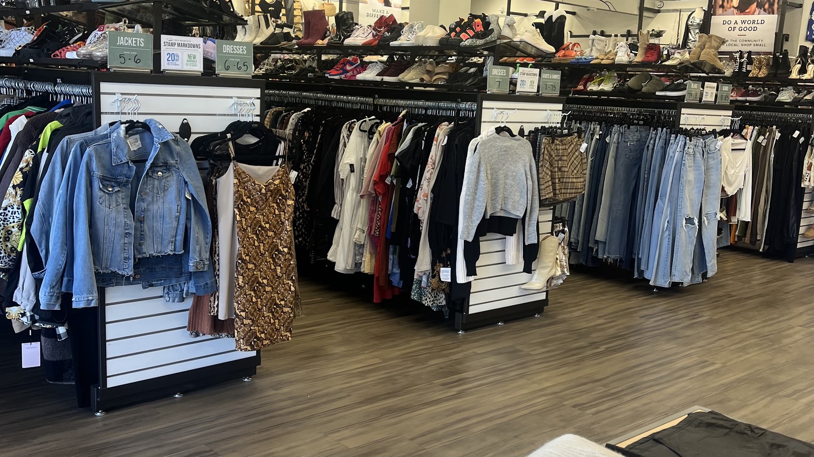 Clothing racks and shoe displays inside Uptown Cheapskate Gilbert