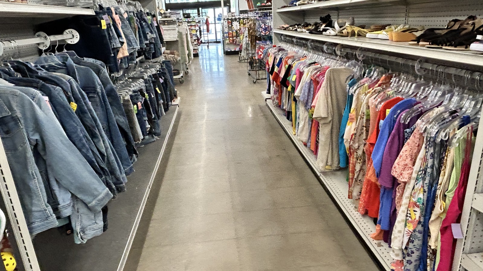 Clothing racks and furniture on the sales floor at Stevens Point Goodwill
