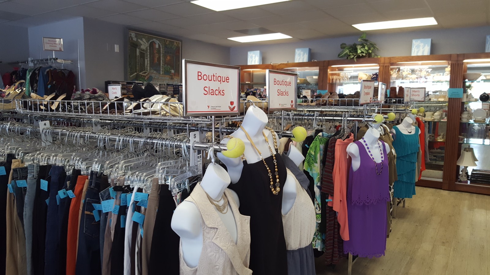 Boutique racks and glass shelves inside Treasure Coast Hospice Foundation Thrift Store in Stuart