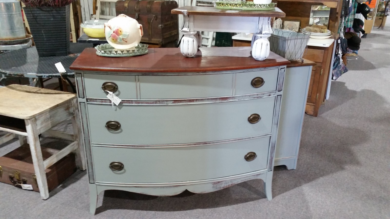 Painted vintage dresser and furniture displays inside Front Range Mercantile in Longmont Colorado