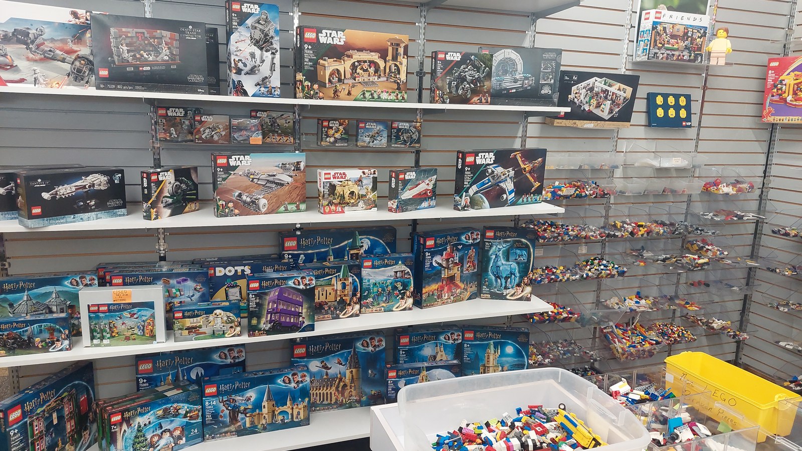 Shelves of Lego sets and toys at Consign a Bubble in Corvallis Oregon