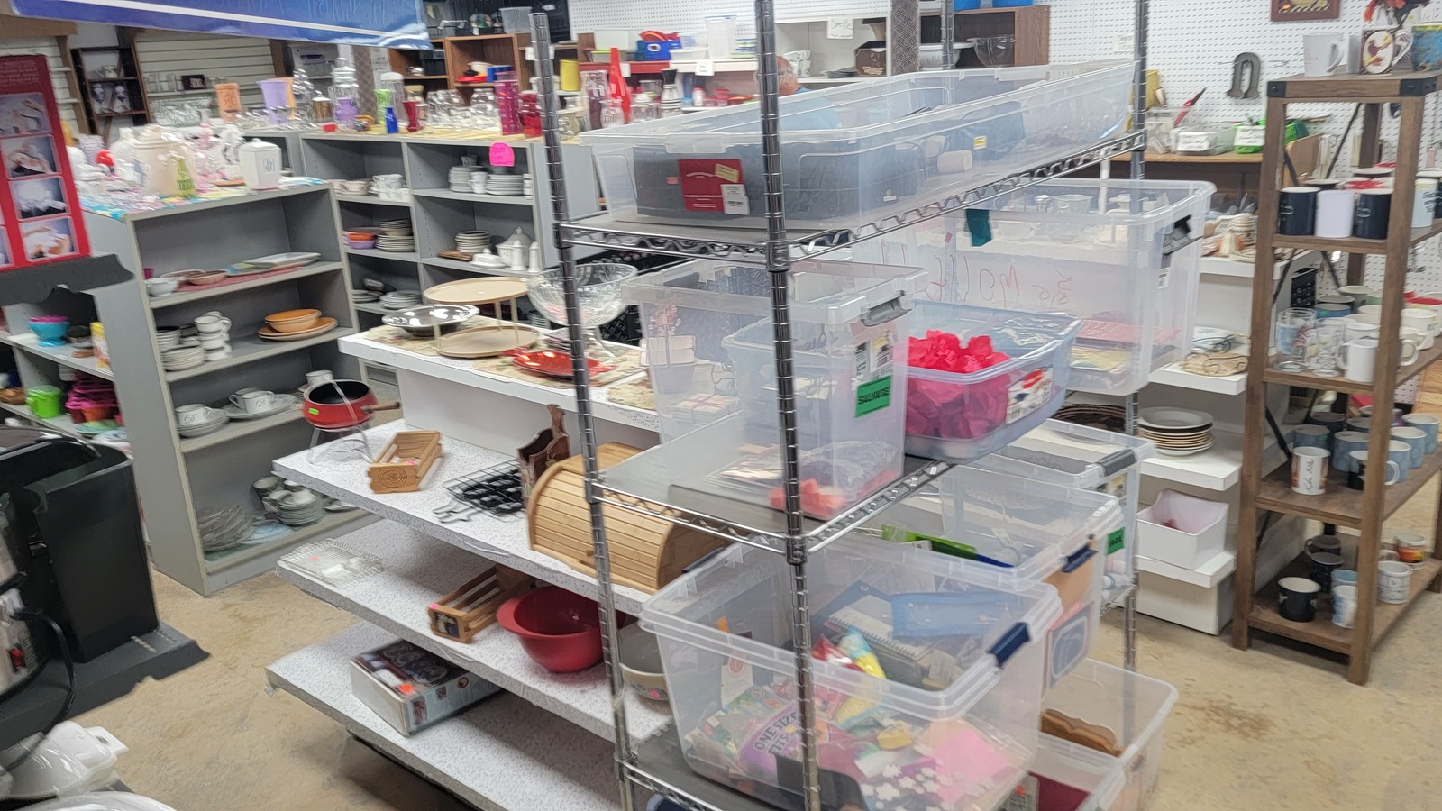 Housewares shelves, mugs, and kitchen finds inside The Salvation Army Family Store in Sheridan