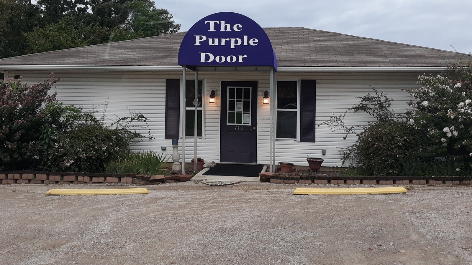 Front entrance and purple awning at The Purple Door in Mountain Home Arkansas