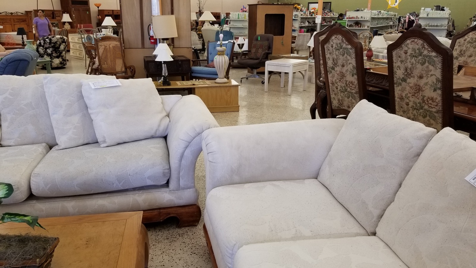 Framed art and home decor inside Sheriffs Ranches Thrift Store in Spring Hill Florida