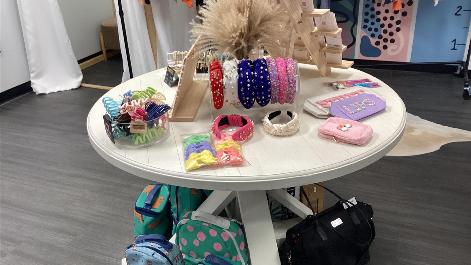 Accessory table with bows bags and small gifts inside As They Grow in Daphne Alabama