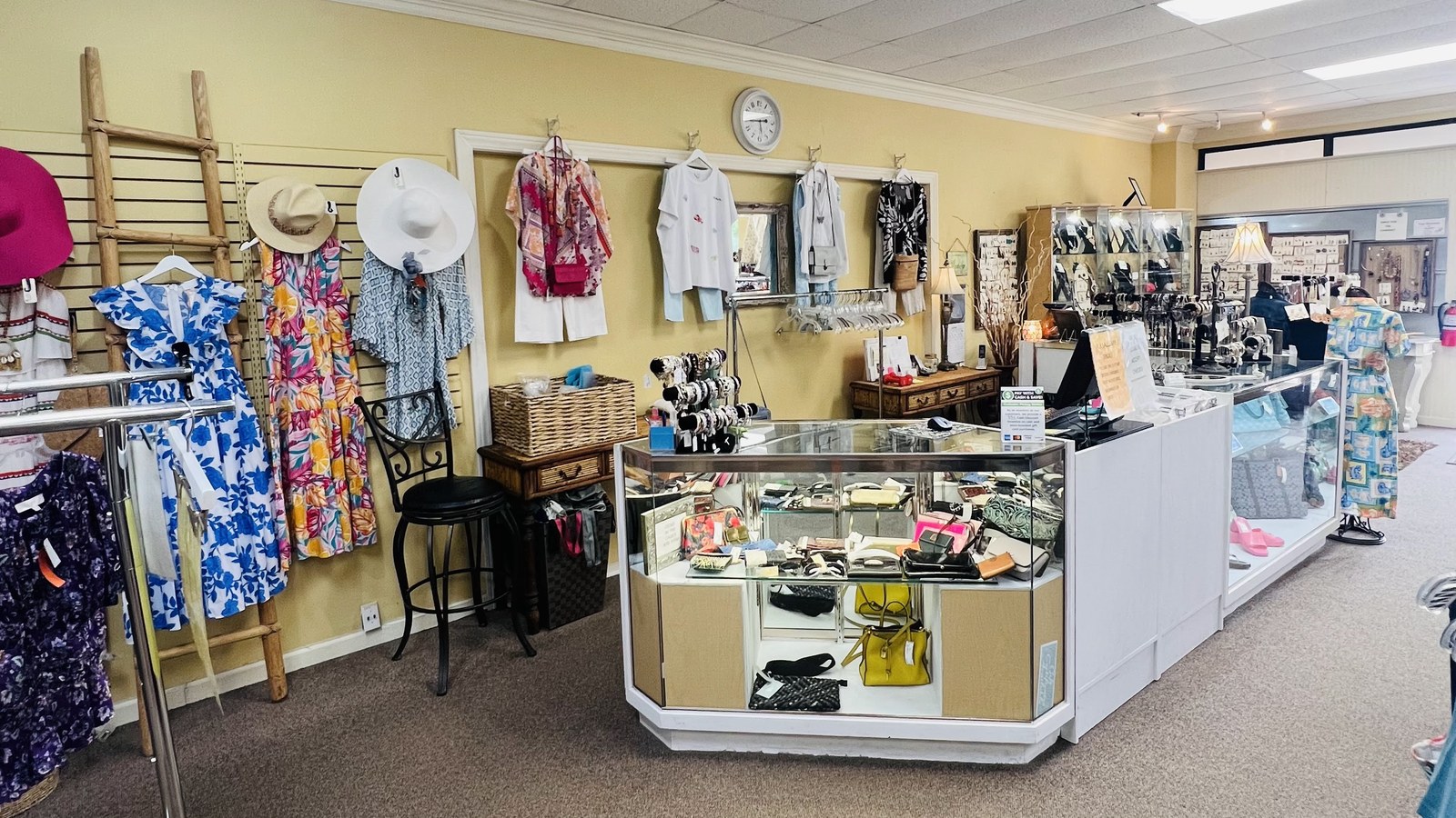 Front counter jewelry case and clothing displays inside Second Edition Boutique in Daphne Alabama