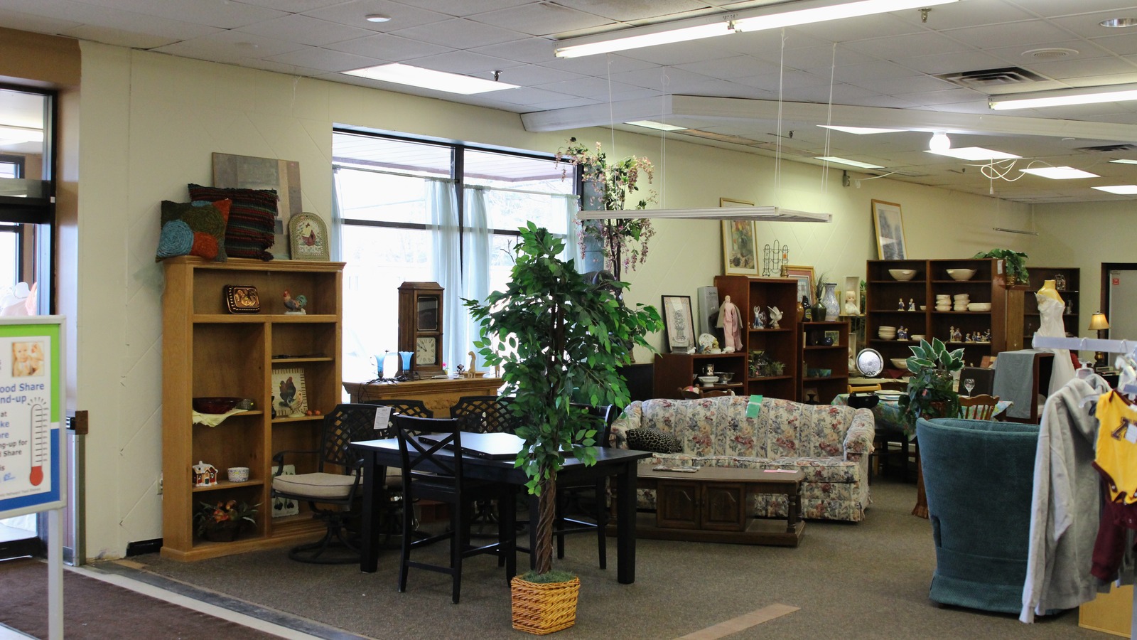 Sofas, shelving, and home furnishings at Family Pathways Thrift Store in Forest Lake