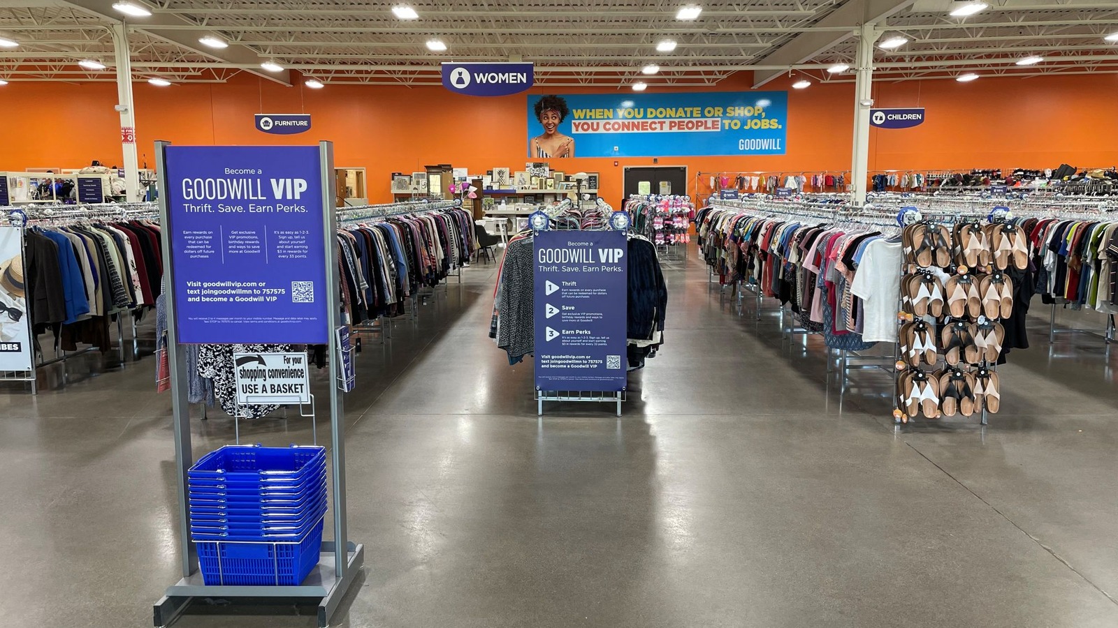 Long clothing aisles inside Goodwill in Forest Lake