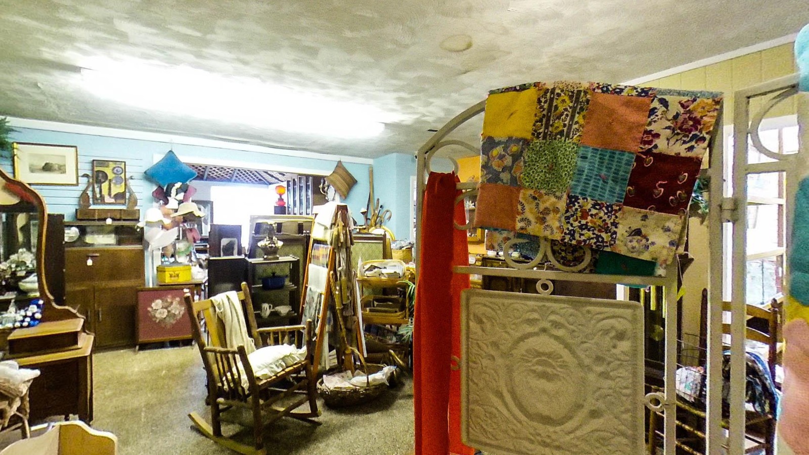 Antiques, textiles, and furniture inside Northglen Antiques in Hays