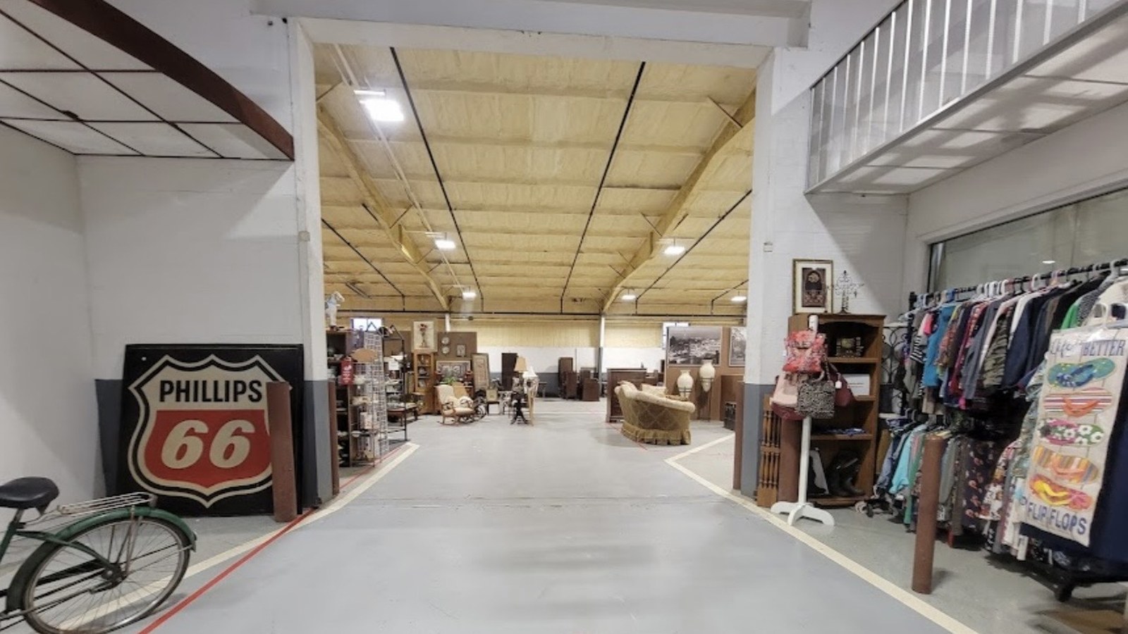 Vendor displays and framed pieces inside The Open Market in Vicksburg Mississippi