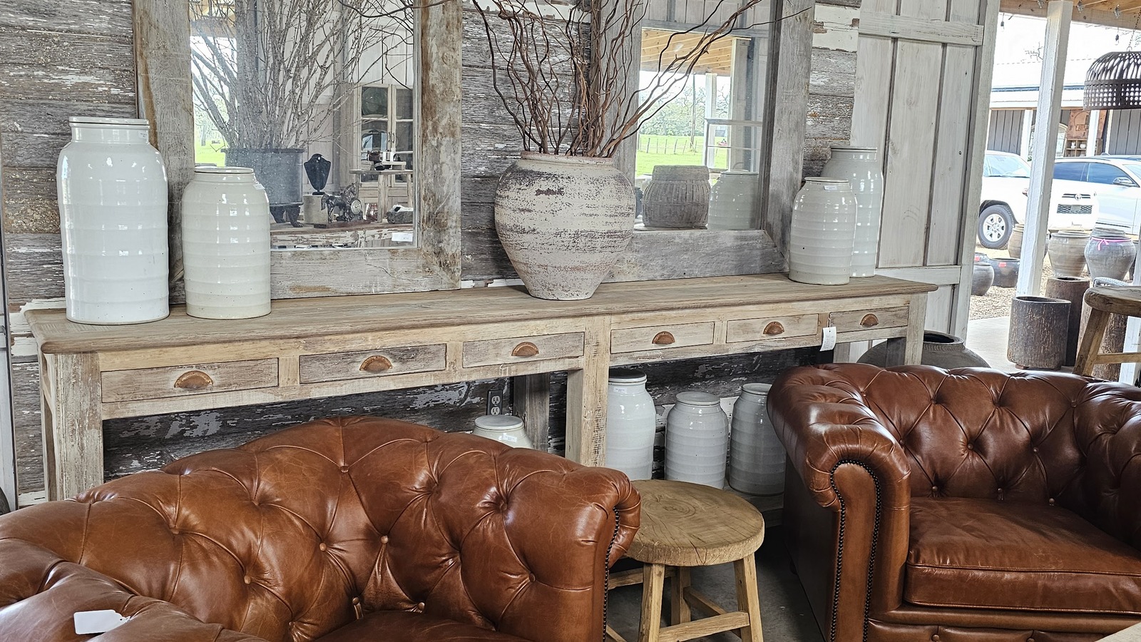 Leather chairs, mirrors, and home decor inside Red Plantation in Poulsbo