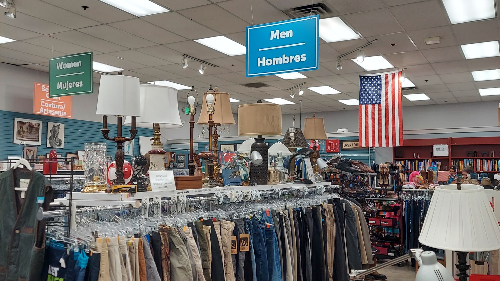 Clothing racks and lamps inside Second Season Boutique in Poulsbo